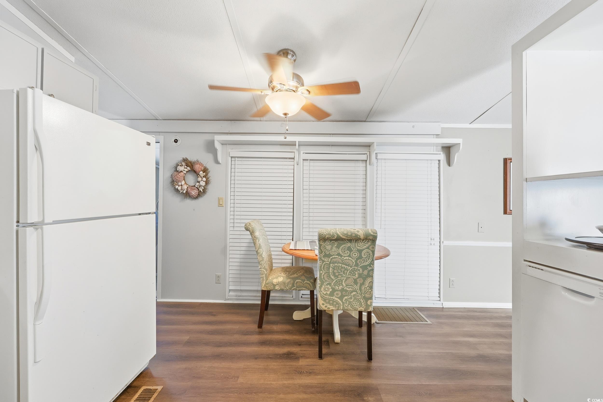 1017 Foxfire Drive North Myrtle Beach, SC 29582 - Photo 10 of 36 Dining space featuring dark wood-style flooring and ceiling fan