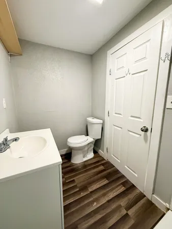 a bathroom with a sink toilet and vanity
