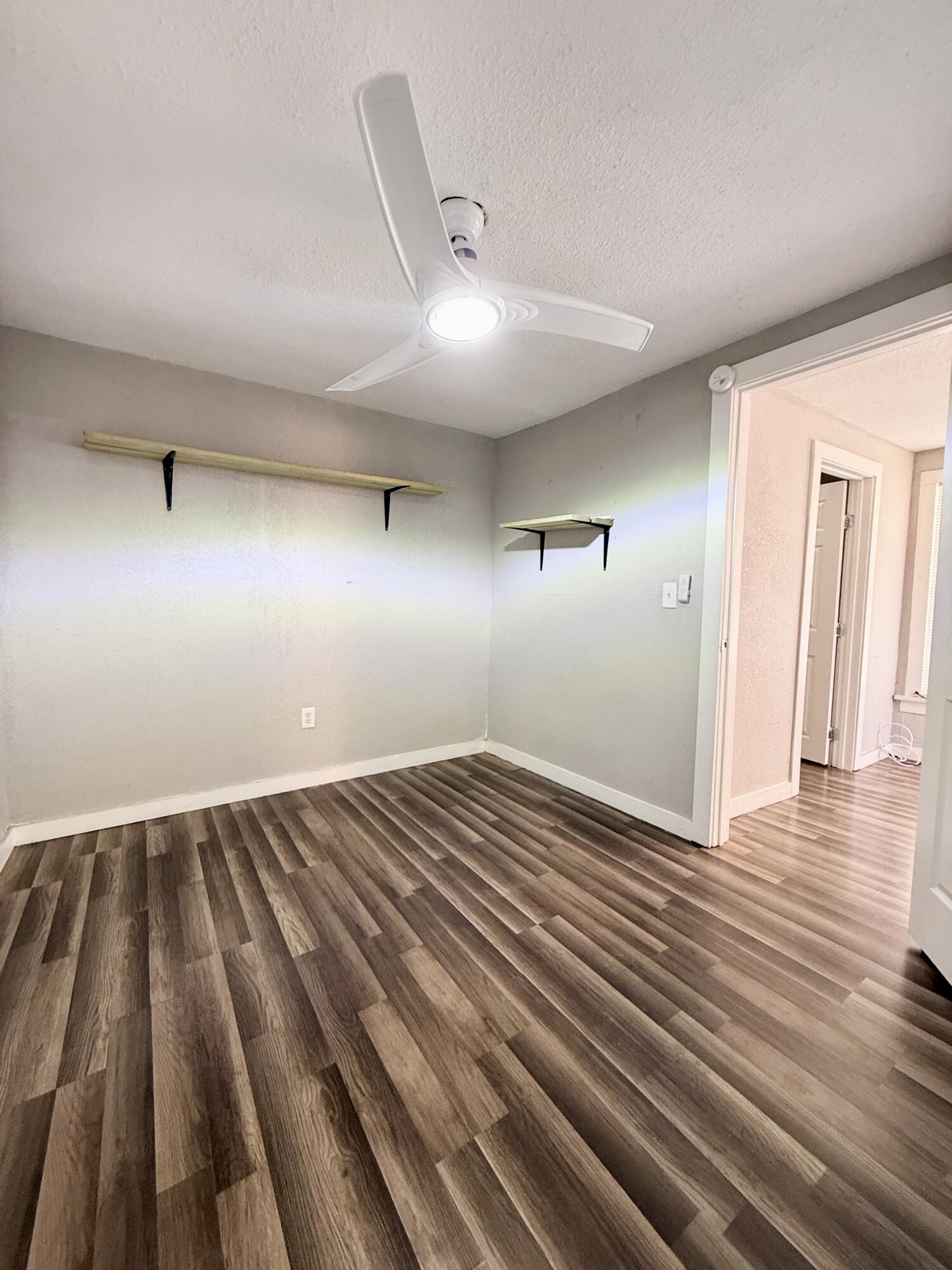 2109 22nd Street, Unit REAR Lubbock, TX 79411 - Photo 8 of 11 wooden floor in an empty room