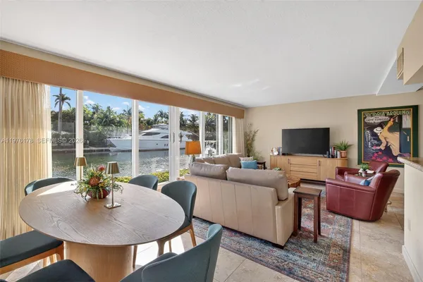 a dining room with furniture and window