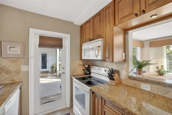 a bathroom with a toilet sink and shower