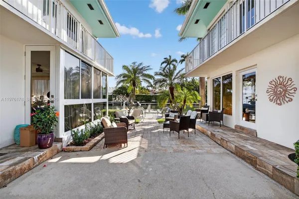 a view of a house with patio outdoor seating area