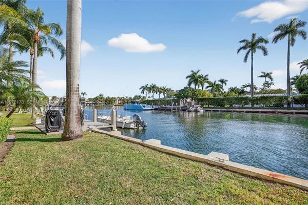 a view of a swimming pool with a table and chairs