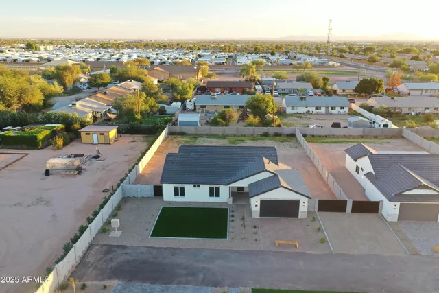 an aerial view of residential houses with outdoor space