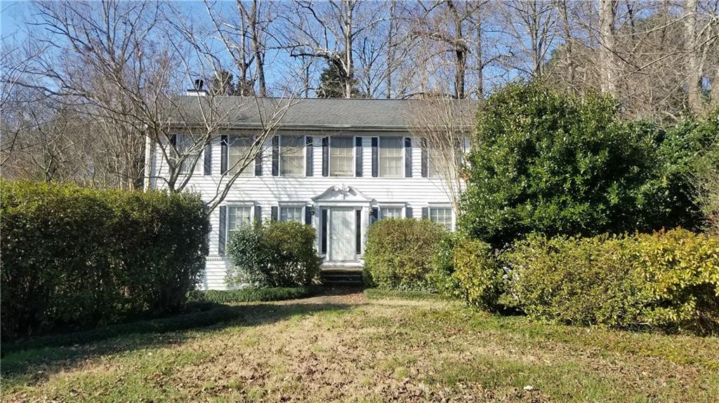 4996 Vermack Road Dunwoody, GA 30338 - Photo 1 of 1 front view of a house with a yard