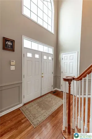 a view of an entryway with wooden floor