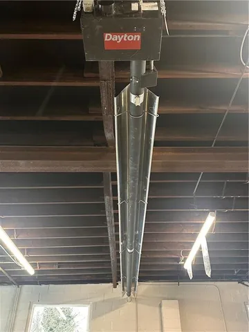 a room with two mirror and a wooden floor