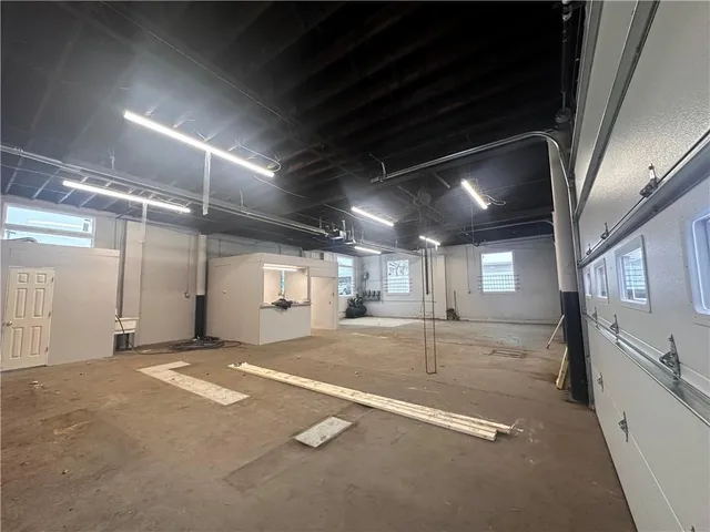 a view of an empty room with windows