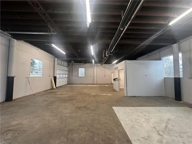 a view of an empty room with windows