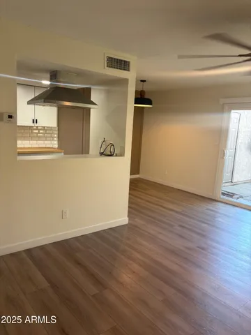 a view of wooden floor in an empty room