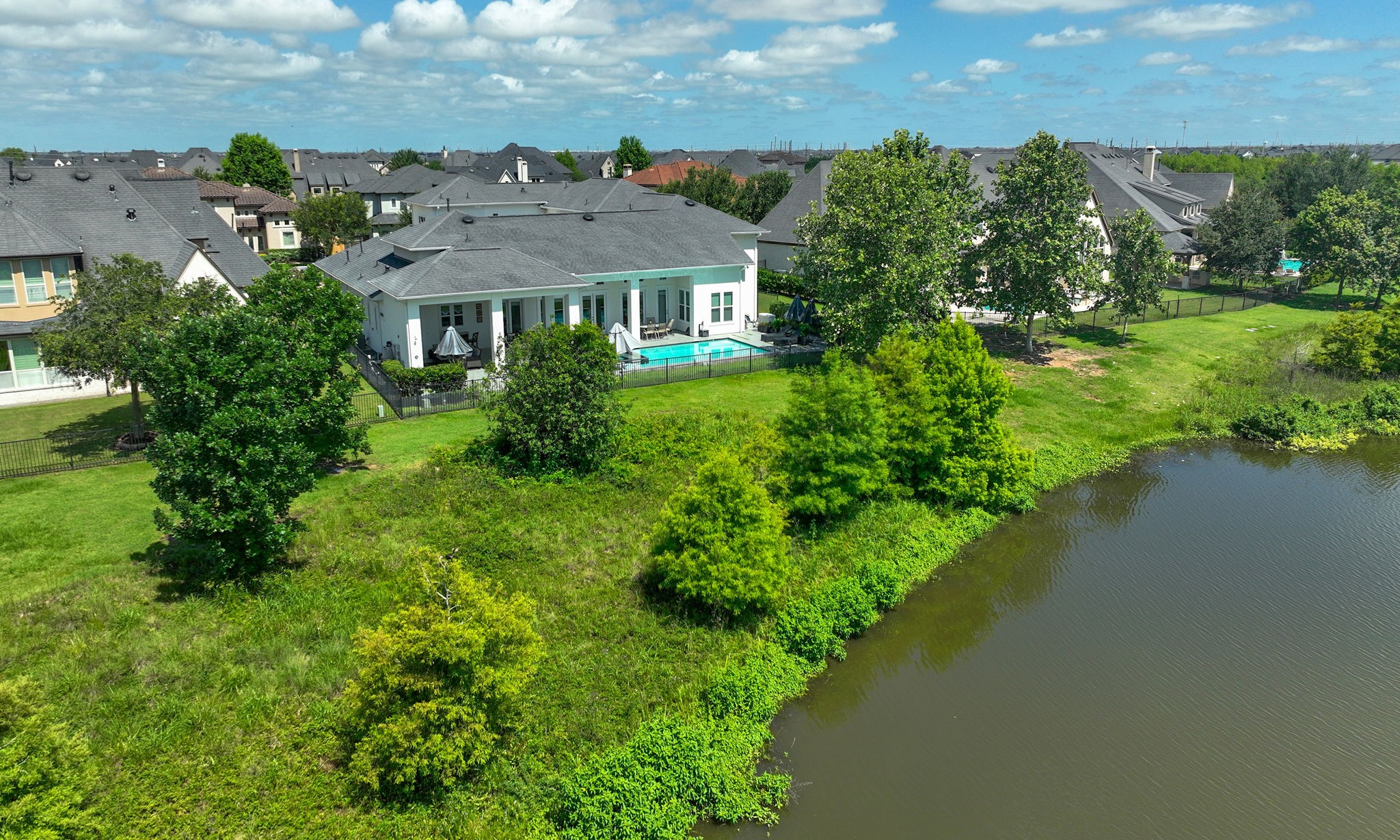 28518 Hoffman Spring Lane Fulshear, TX 77441 - Photo 43 of 50 Stunning views of Heron Lake right from your own backyard.