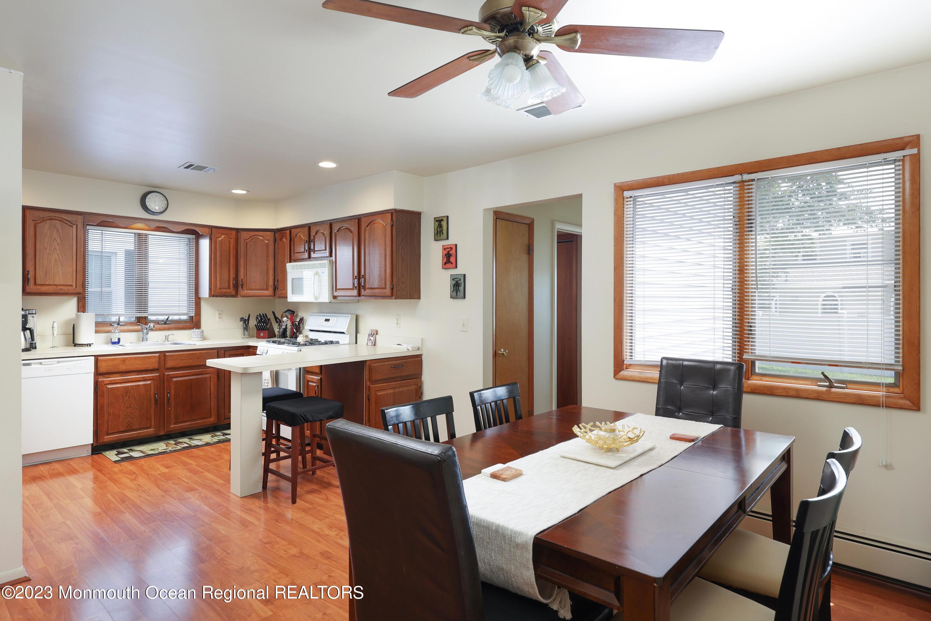 1719 River Road Belmar, NJ 07719 - Photo 14 of 32 a view of a dining room with furniture window and wooden floor
