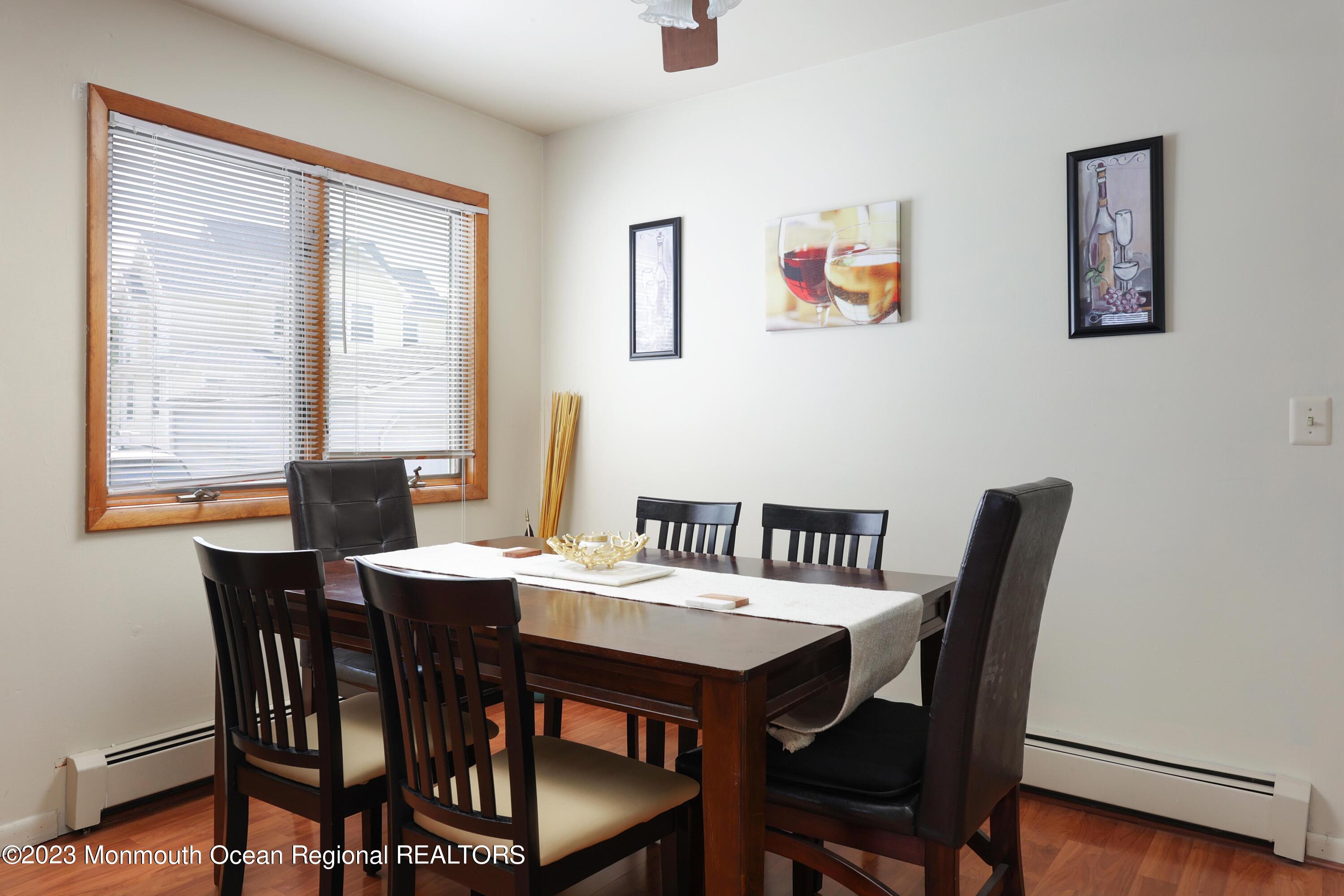1719 River Road Belmar, NJ 07719 - Photo 15 of 32 a view of a dining room with furniture window and wooden floor
