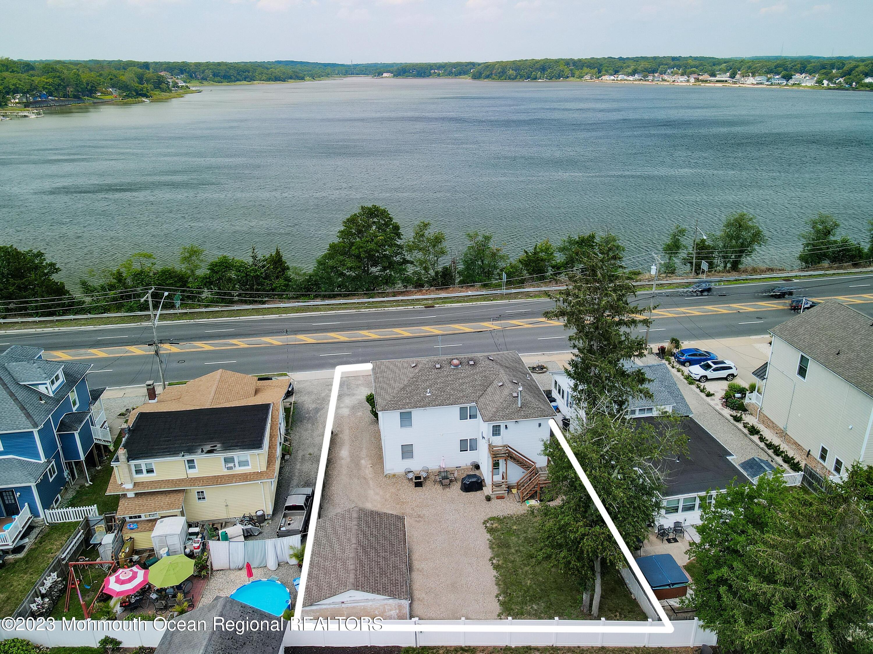 1719 River Road Belmar, NJ 07719 - Photo 23 of 32 an aerial view of a house with a lake view