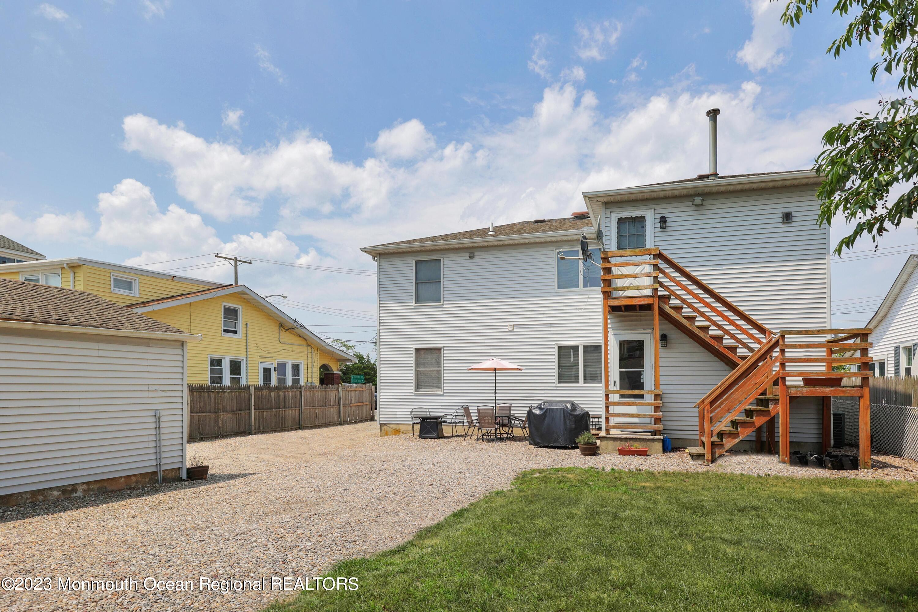 1719 River Road Belmar, NJ 07719 - Photo 24 of 32 a view of a house with a yard