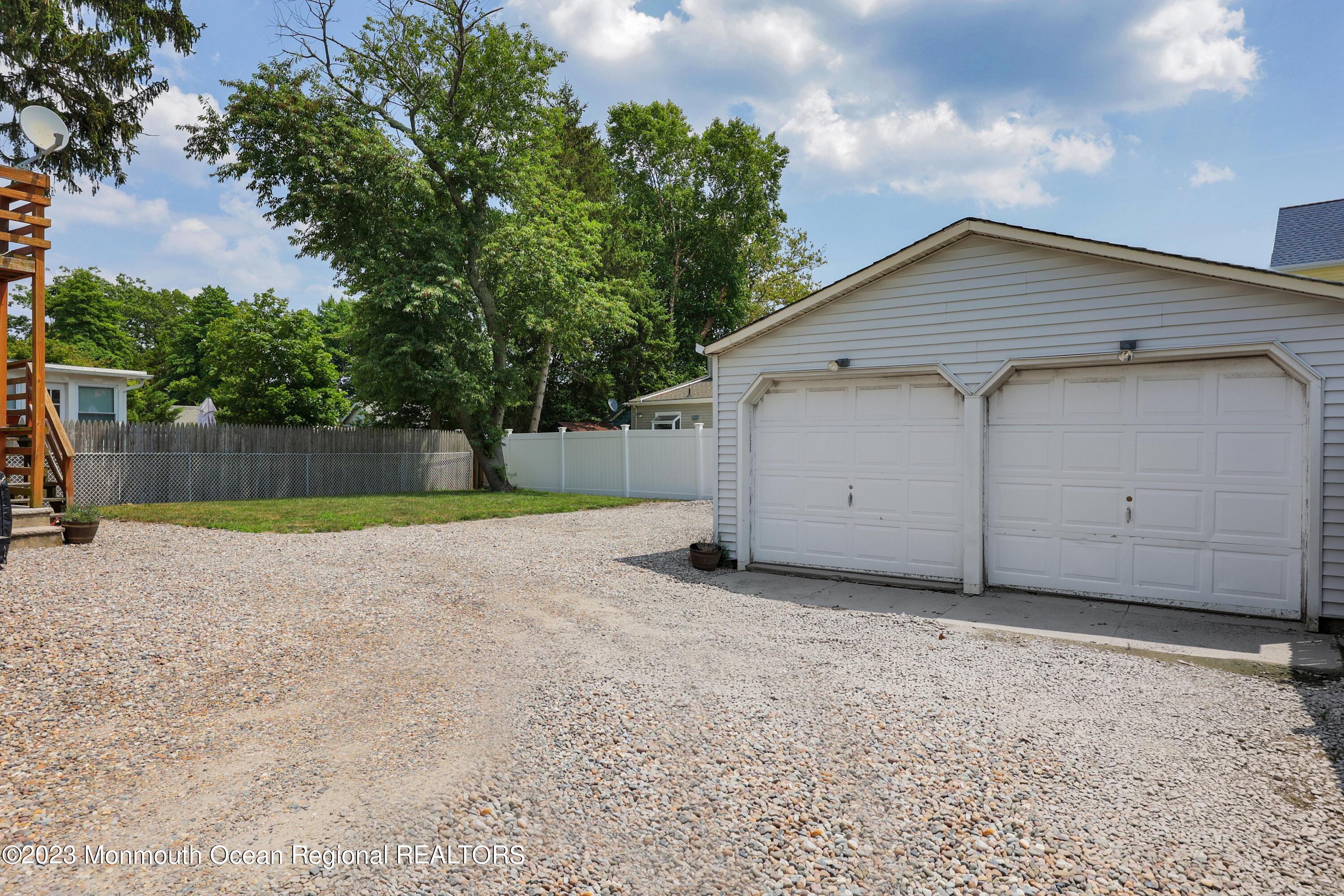 1719 River Road Belmar, NJ 07719 - Photo 25 of 32 a view of a house with a backyard