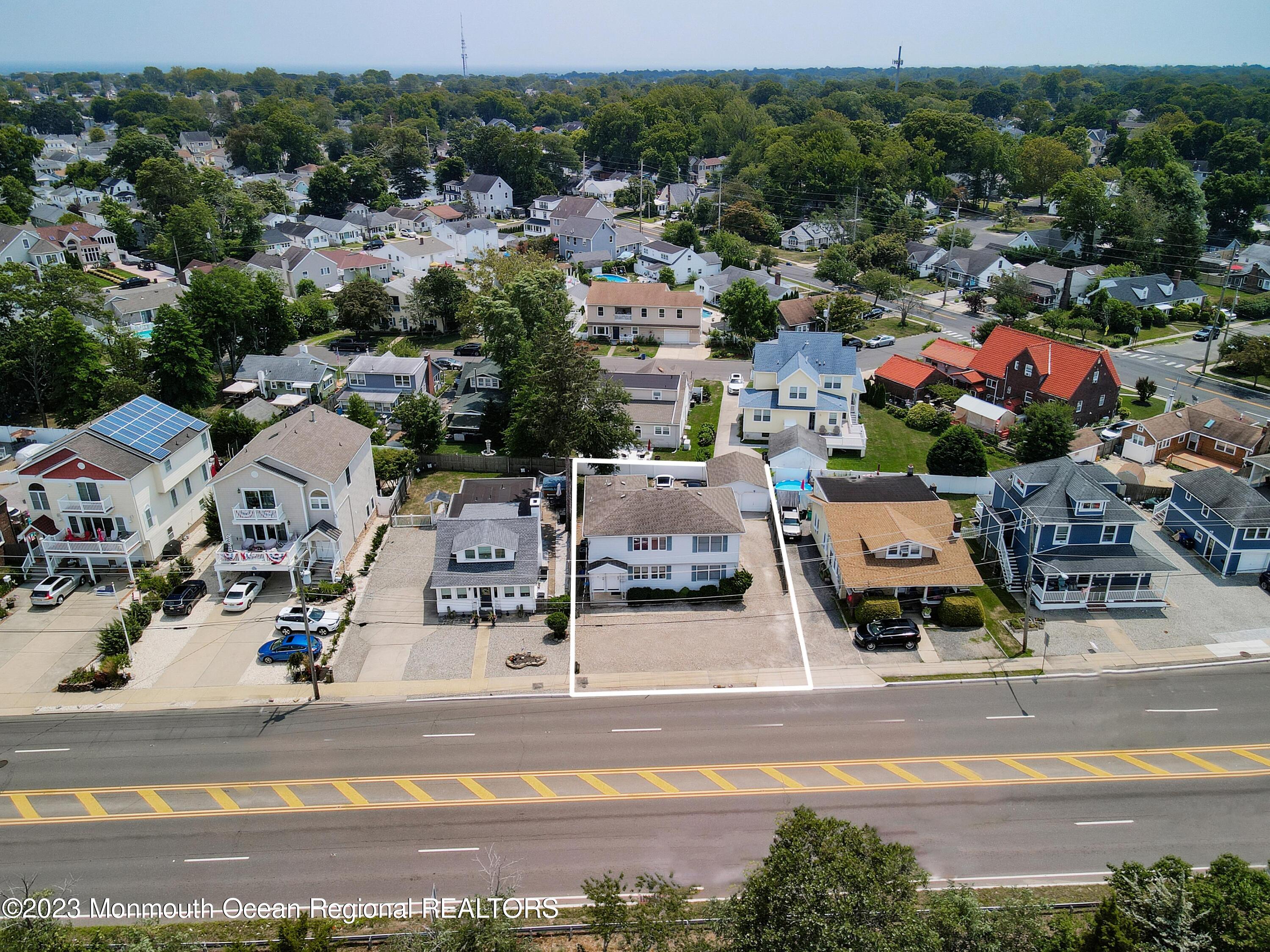 1719 River Road Belmar, NJ 07719 - Photo 4 of 32 an aerial view of residential houses with outdoor space and parking