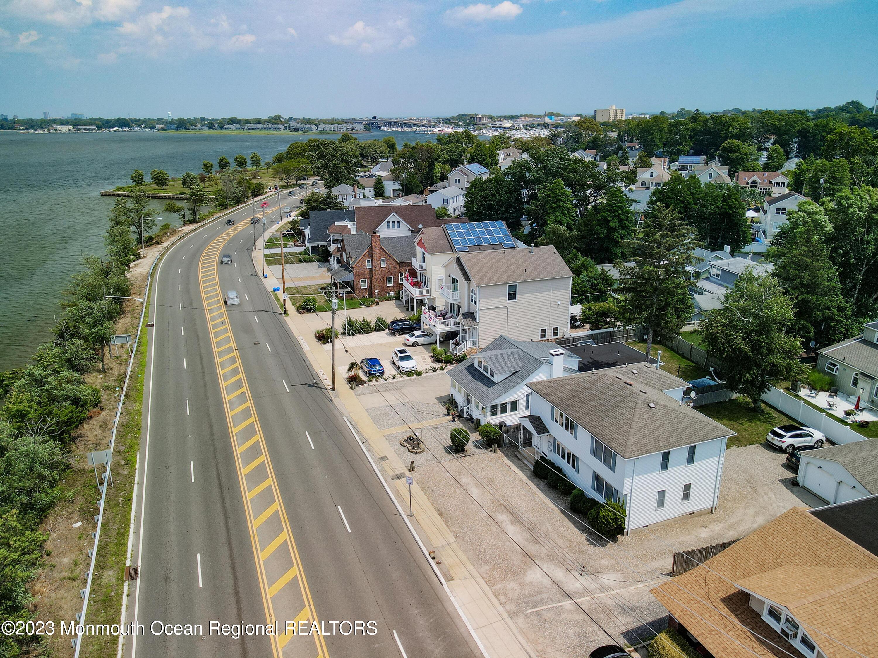 1719 River Road Belmar, NJ 07719 - Photo 10 of 32 an aerial view of a house with outdoor space and lake view