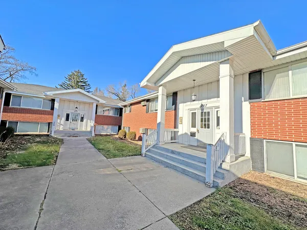 front view of a house with a yard