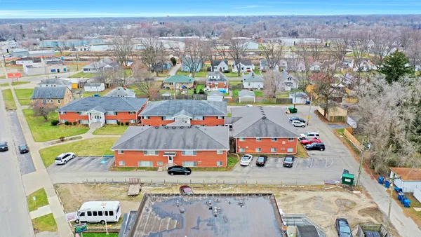 an aerial view of residential houses with outdoor space