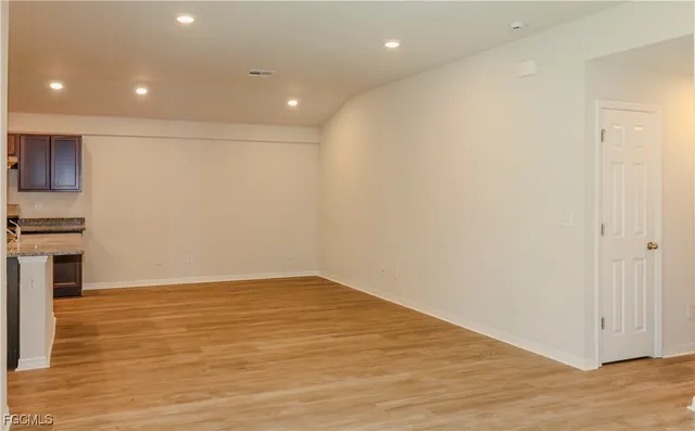 a view of kitchen with wooden floor