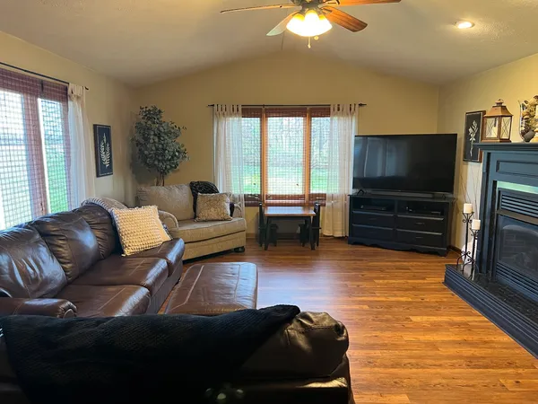 a living room with furniture and a flat screen tv