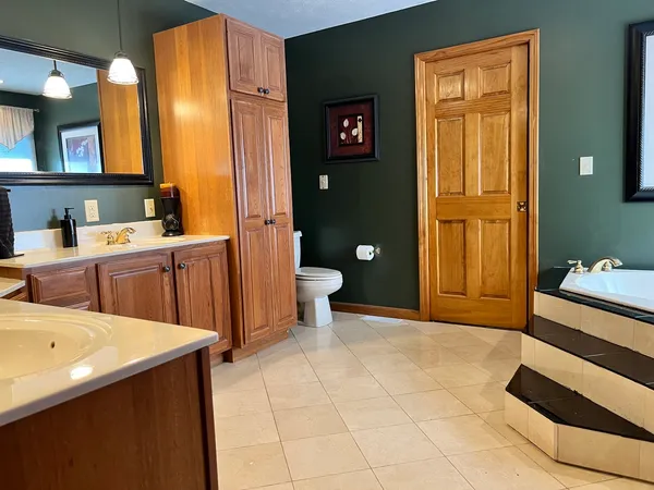 a view of a bathroom with sink and mirror