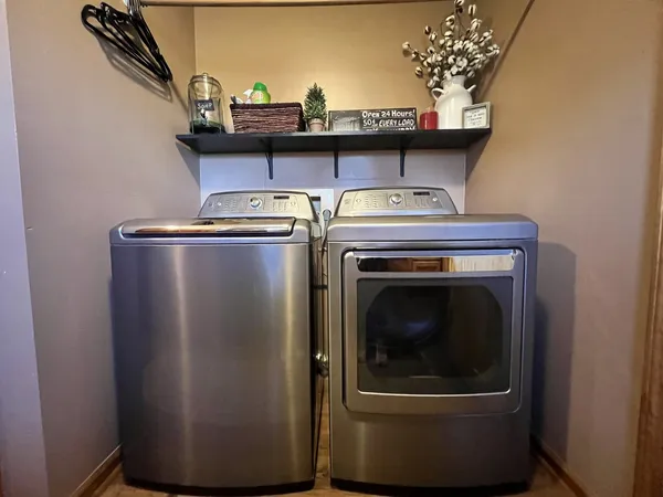 a close view of a utility room with washer and dryer