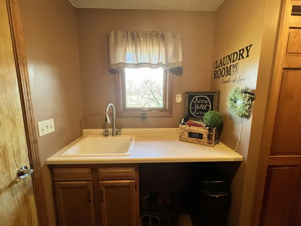 a bathroom with a sink and a window