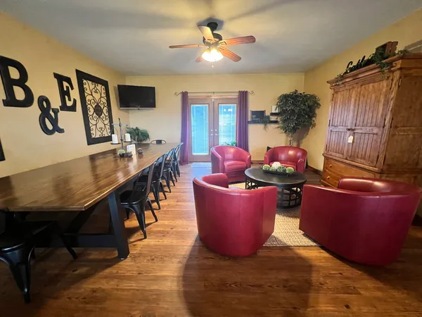a living room with furniture and a flat screen tv