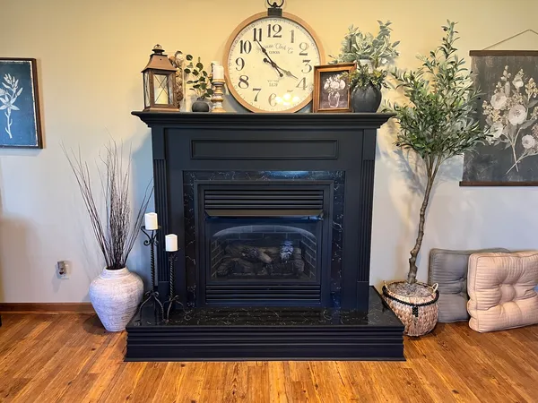 a living room with furniture and a fireplace