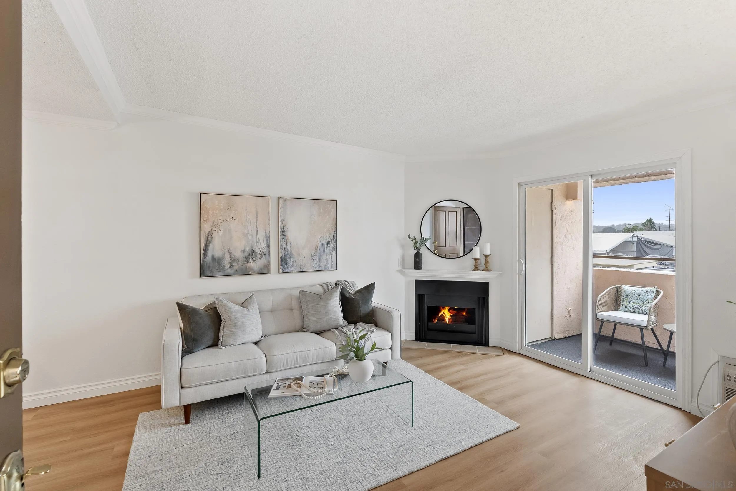 830 Broadway, Unit 15 El Cajon, CA 92021 - Photo 5 of 21 a living room with furniture and a fireplace