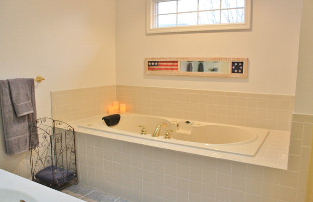 3880 Davis Road Penn Laird, VA 22846 - Photo 15 of 20 a bathroom with a tub a sink and a shower