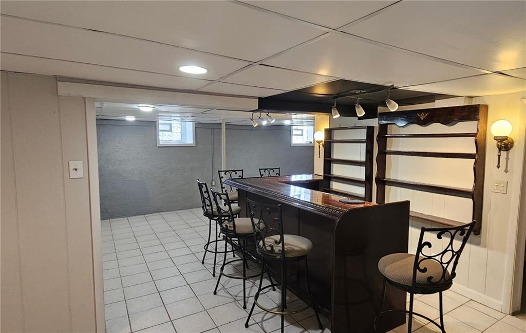 54 Terrace Road Millsboro, PA 15348 - Photo 36 of 49 The finished lower level has a cool bar...