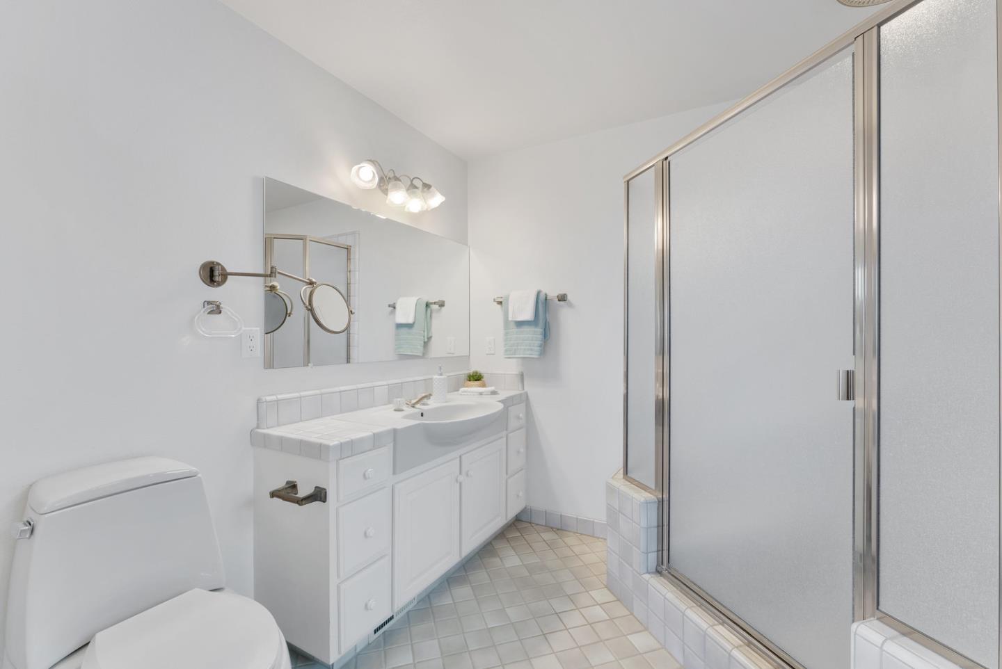 1385 Prospect Avenue Capitola, CA 95010 - Photo 24 of 41 a bathroom with a toilet sink and mirror