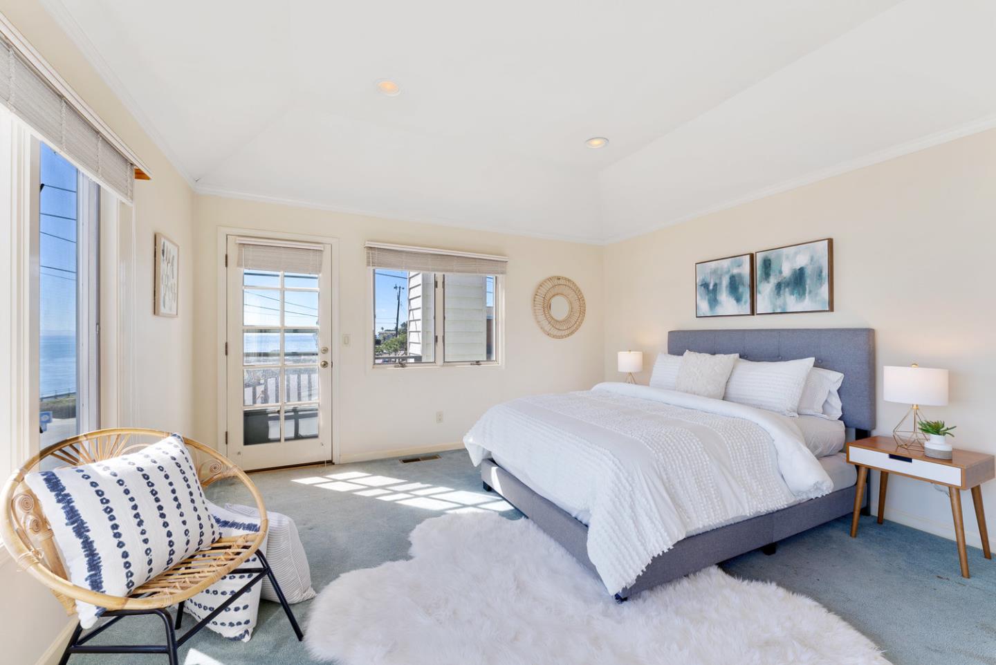 1385 Prospect Avenue Capitola, CA 95010 - Photo 26 of 41 a bedroom with a large bed and a chair