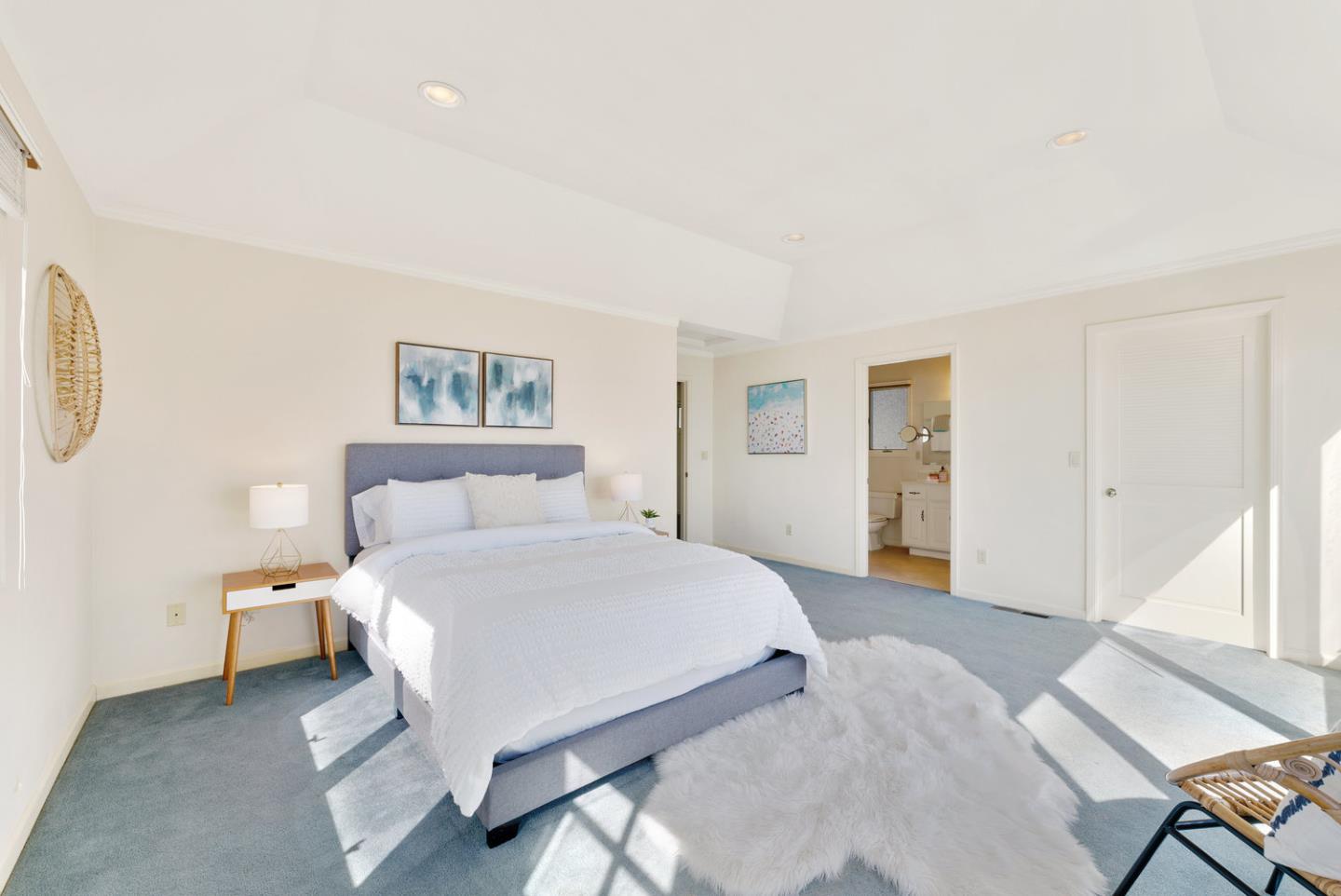 1385 Prospect Avenue Capitola, CA 95010 - Photo 27 of 41 a spacious bedroom with a bed and a window