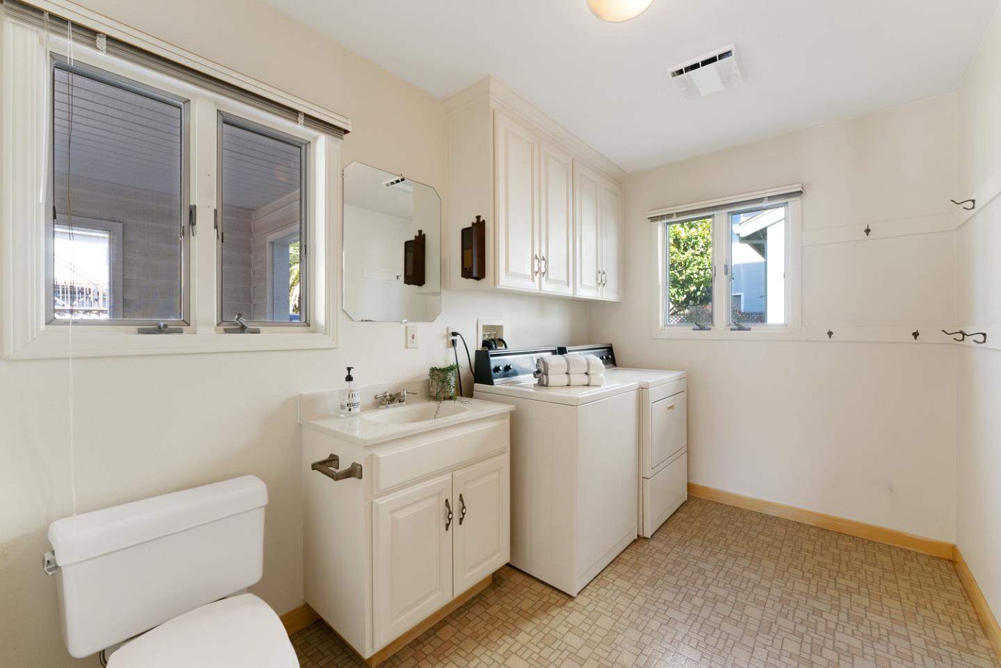 1385 Prospect Avenue Capitola, CA 95010 - Photo 29 of 41 a view of bathroom with a toilet sink and a window