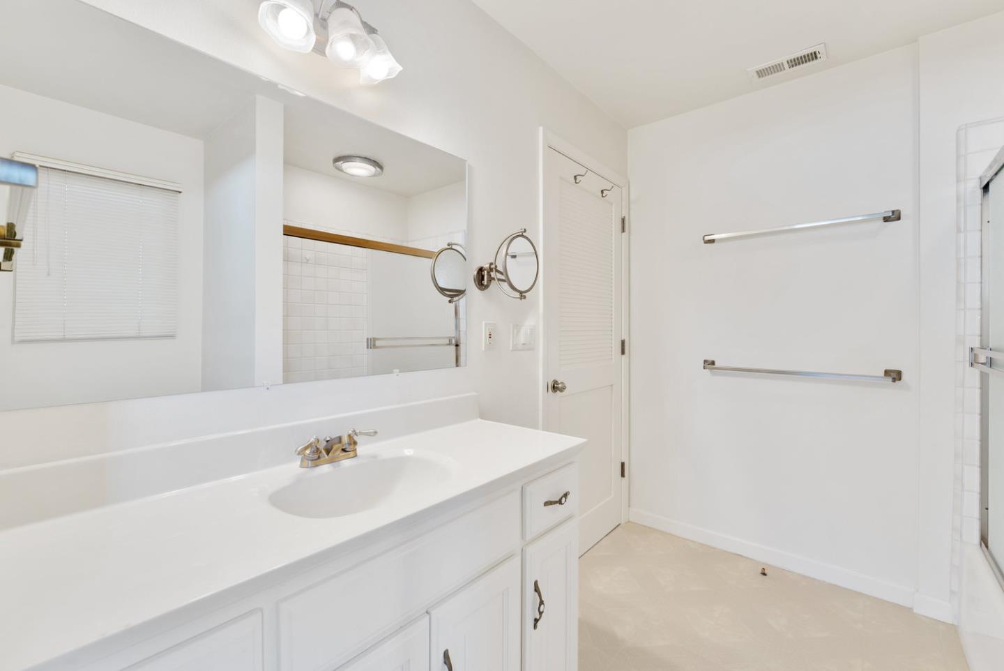 1385 Prospect Avenue Capitola, CA 95010 - Photo 32 of 41 a bathroom with a sink and a mirror