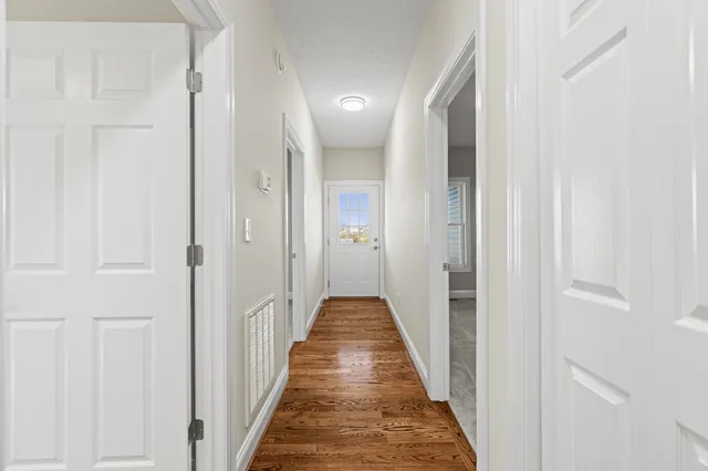 a bathroom with a double vanity sink toilet and a window