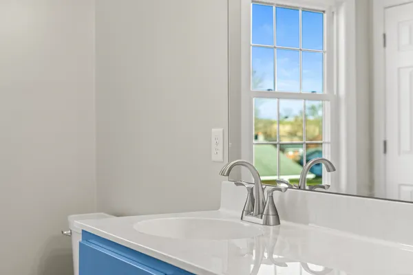 a close view of a sink and a window