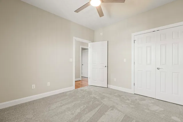a view of a balcony with wooden floor