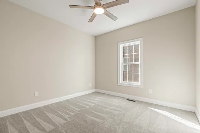 a view of a balcony with wooden floor