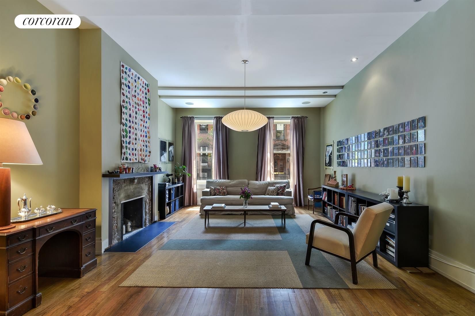 81 Remsen Street, Unit 2 Brooklyn, NY 11201 - Photo 1 of 1 a living room with furniture and a fireplace