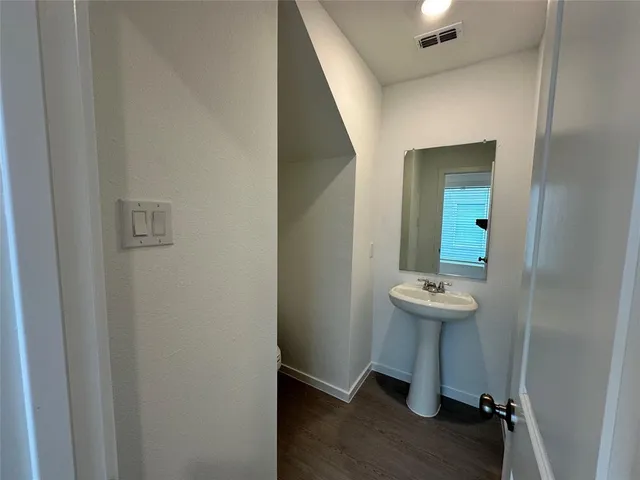 a bathroom with a sink and mirror