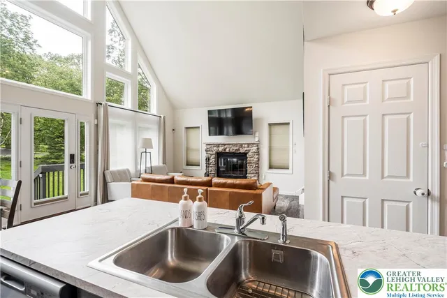 a kitchen with a sink and a stove top oven