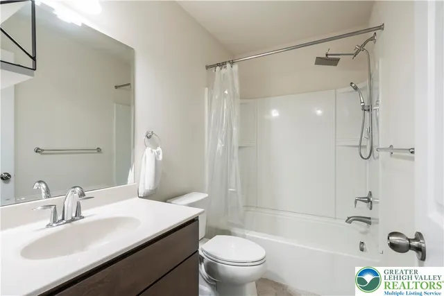 a bedroom with furniture and large windows