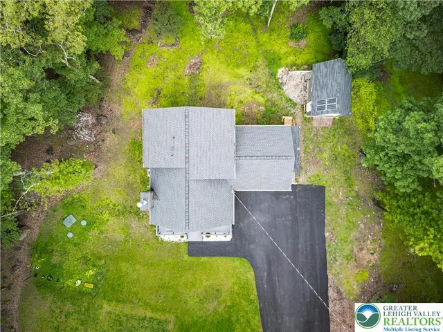 a view of a big yard with lots of green space