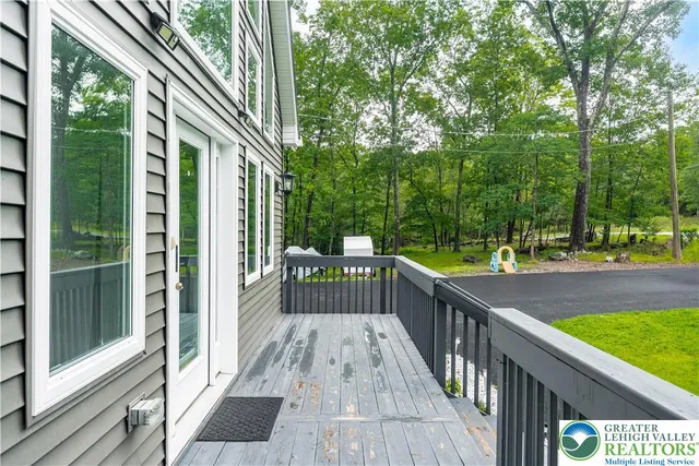 a view of balcony and yard
