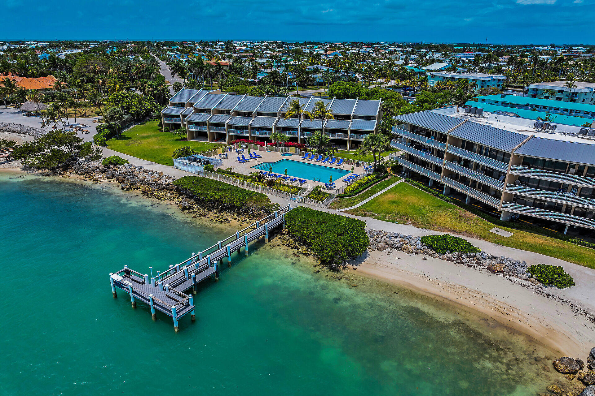 1133 West Ocean Drive, Unit 6 Key Colony Beach, FL 33051 - Photo 18 of 73 an aerial view of a house with a garden and lake view